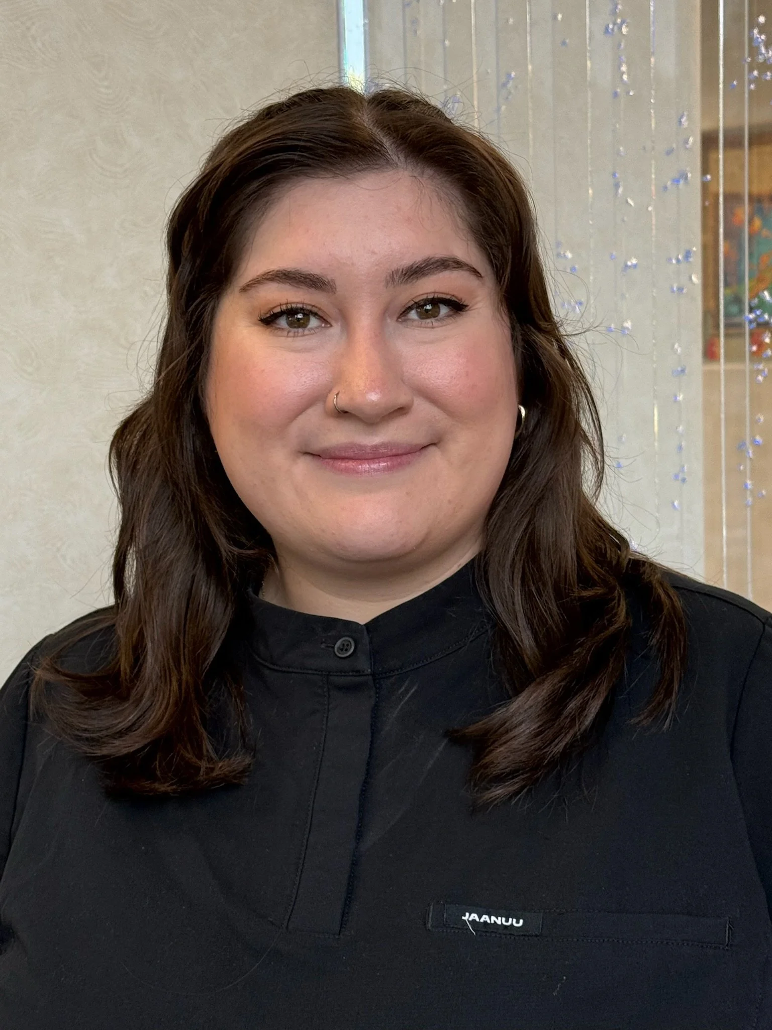 Staff member, Suzy smiling in the pediatric dental office