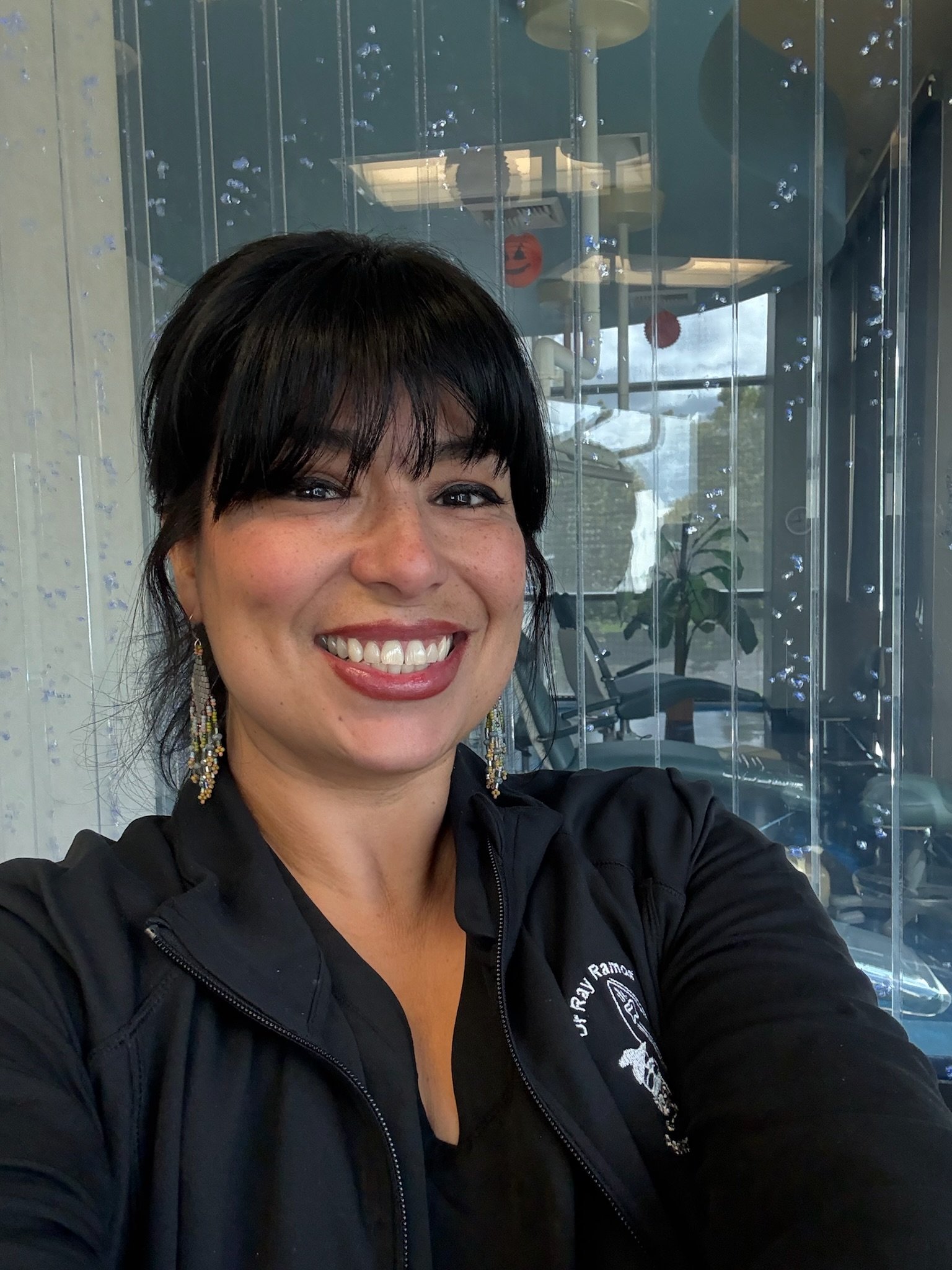 Staff member, Myriah smiling in the pediatric dental office