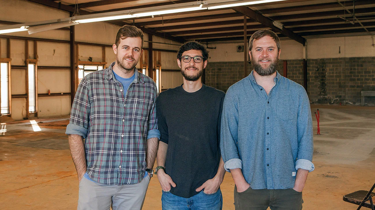 Resident Culture Team inside the future brewery. Photo from Charlotte Agenda; see the full article via the link above