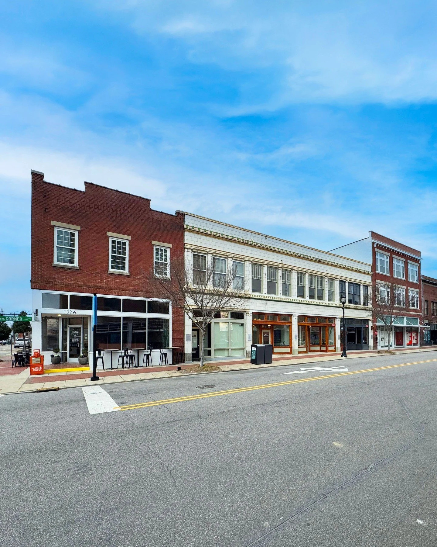 Three buildings that sit side by side in downtown Wilson, NC, each have their own unique story, history, and architecture. After understanding the history and the program for each client we delivered:

1. Corner building - Interior upfit + lighting s
