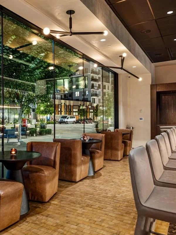 Our design team has once again partnered with renowned chef Scott Crawford, this time to create Crawford Brothers Steakhouse in Fenton. The final result is a space that feels both familiar and elevated. Dark materials set the tone for a traditional m