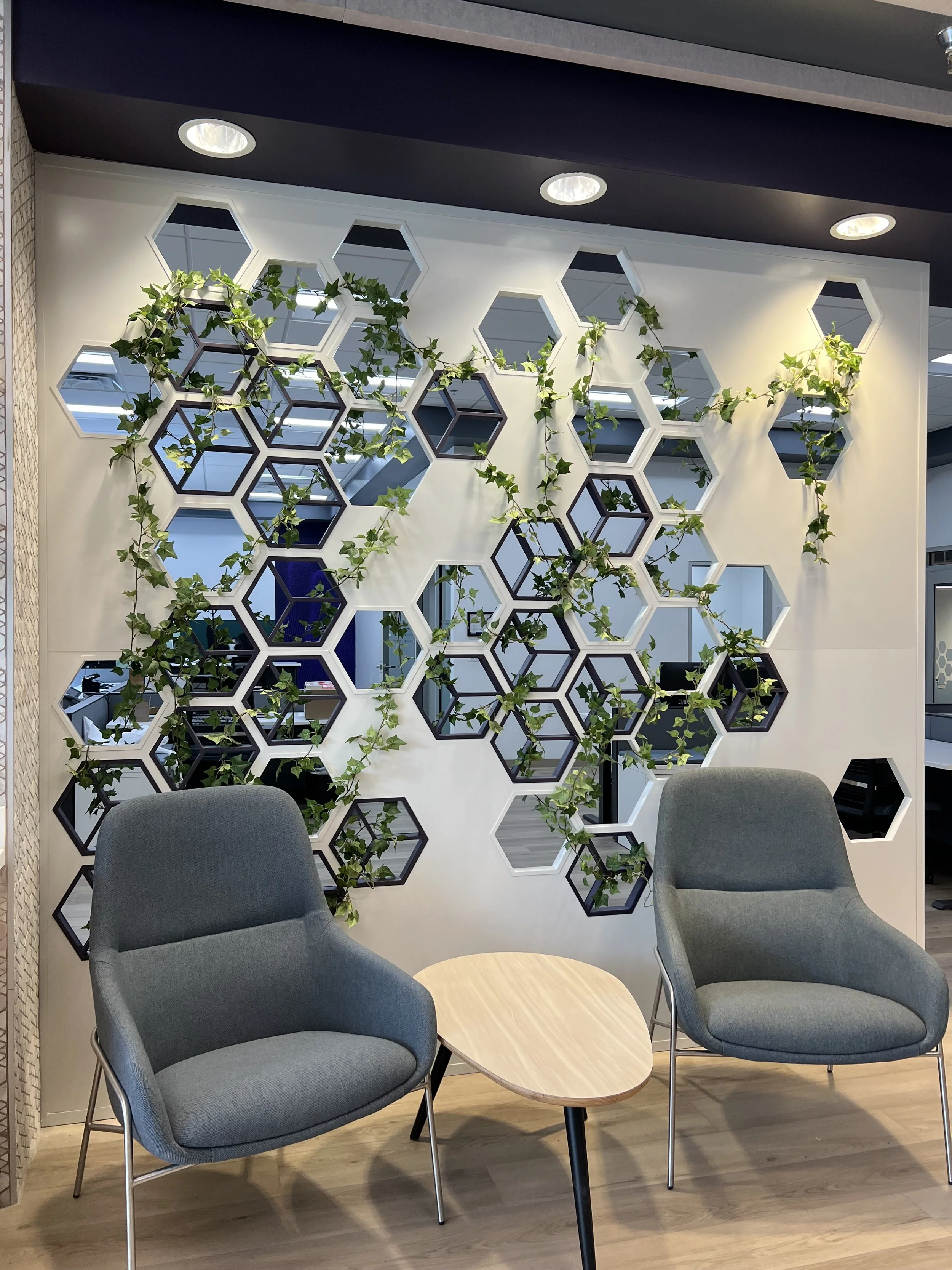 Faux ivy weaving through wall at Antech Diagnostics in Dallas, TX. Indianapolis live plant service.