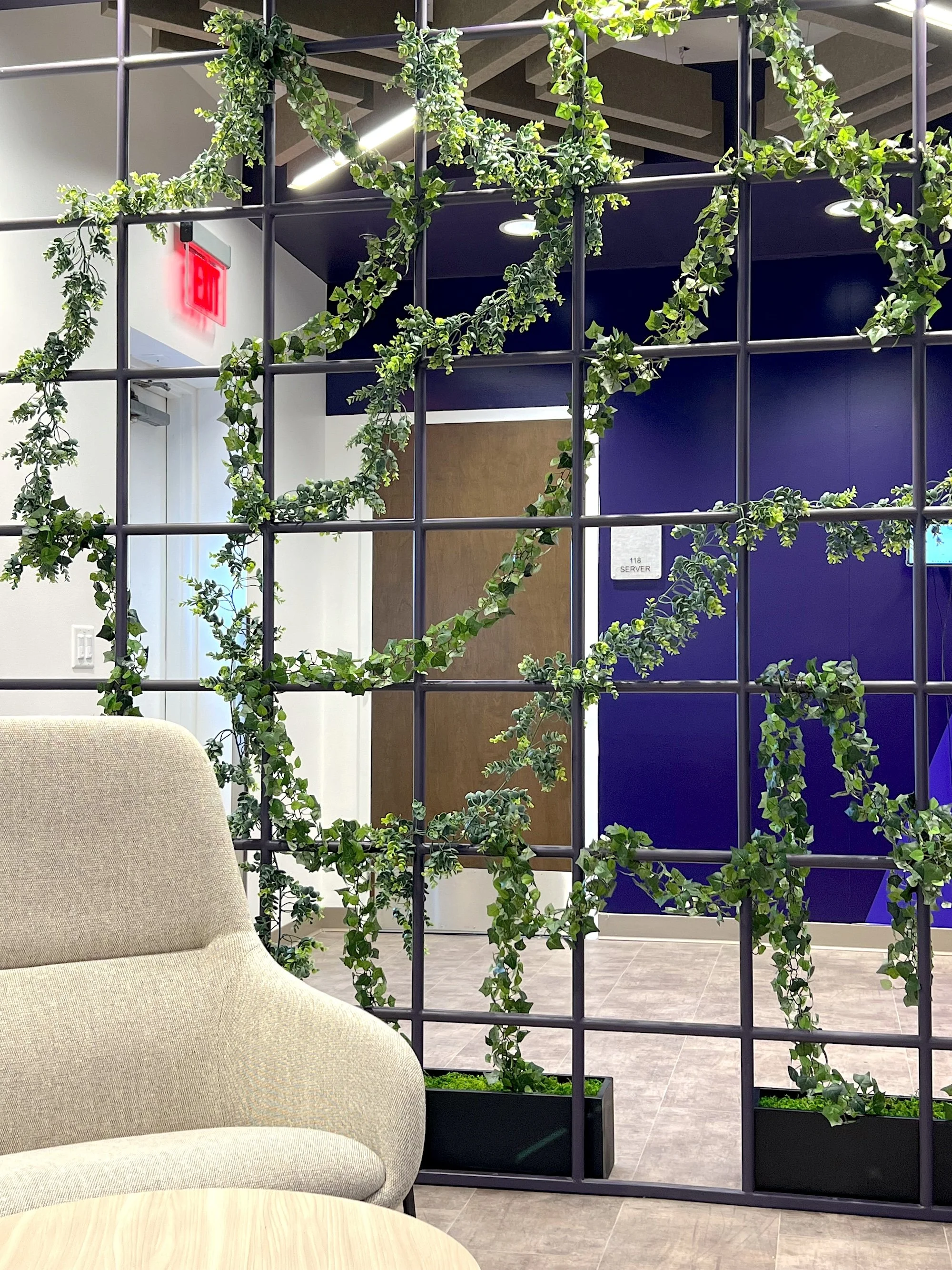 Faux Greenery weaving through wall at Antech Diagnostics in Dallas, TX. Indianapolis plant service.