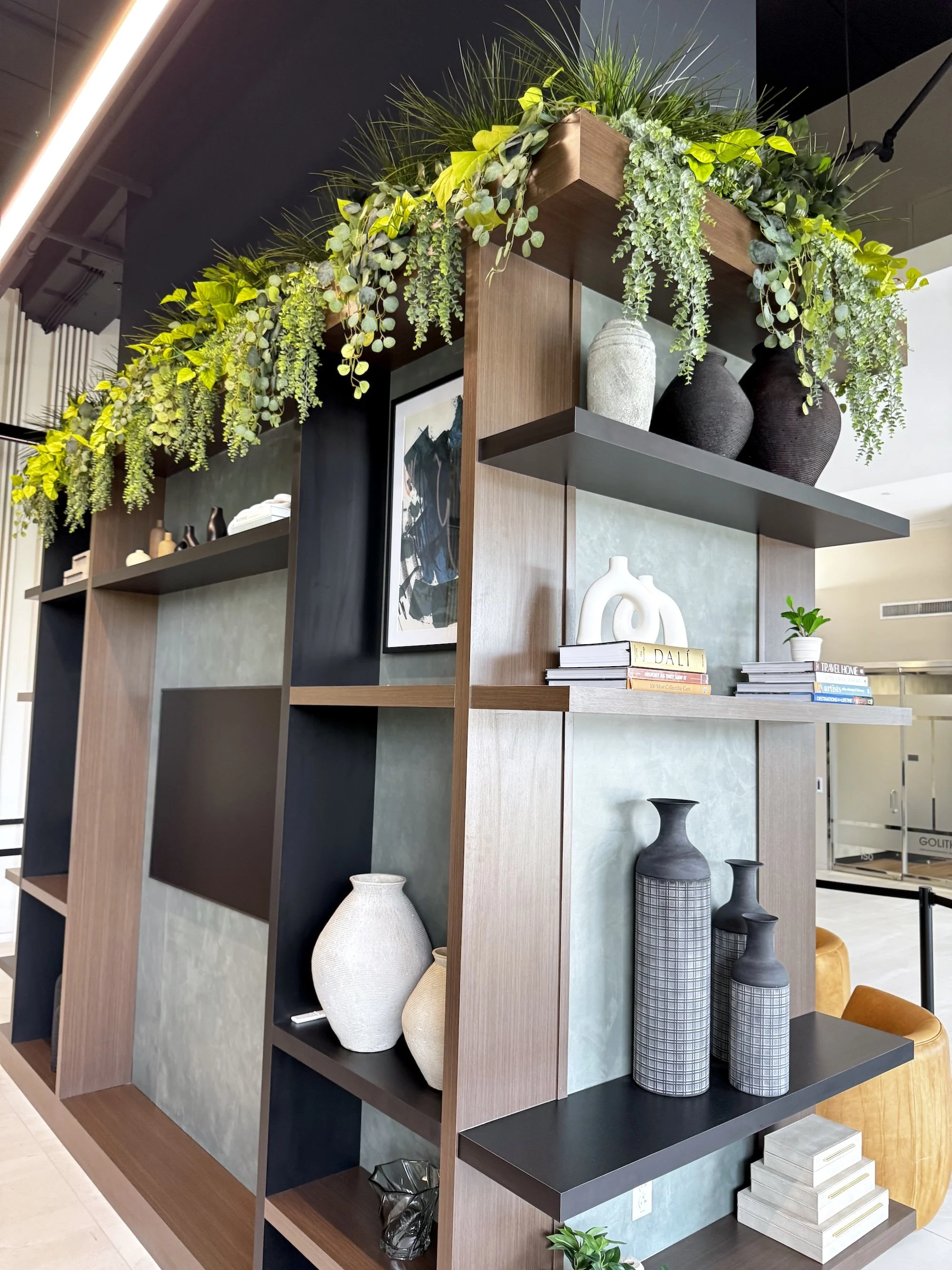 Artificial Greenery on shelf at Keystone at the Crossing office building. Faux Greenery in Indianapolis, IN.