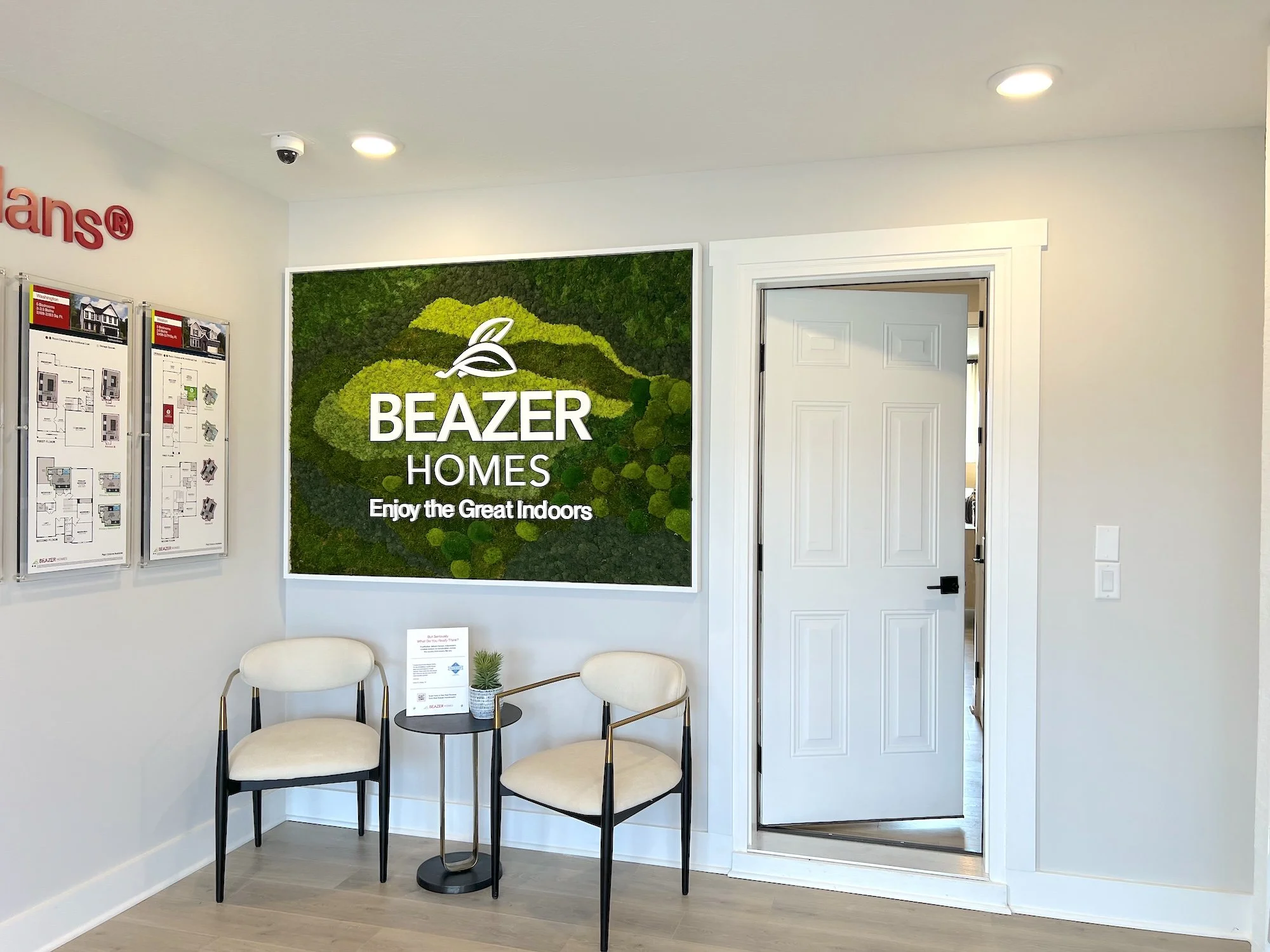 Custom moss art installation for a Beazer Homes show home in Westfield, Indiana, featuring a beautifully preserved moss design with the Beazer Homes logo. This unique biophilic piece adds natural texture, brand identity, and a low-maintenance greener