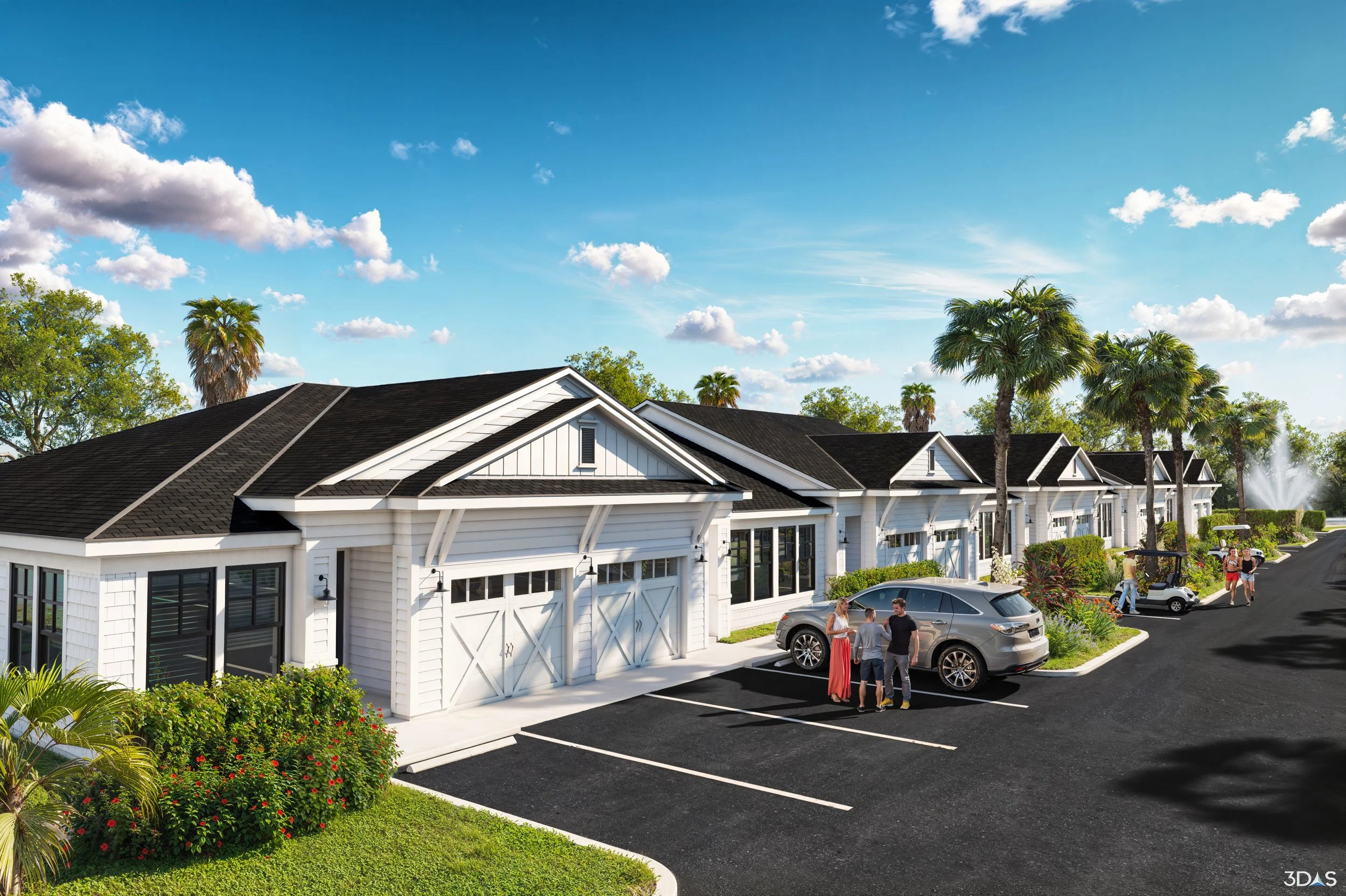 Open-concept kitchen and living room with pastel-colored decor, floral accents, and natural light streaming through large windows.