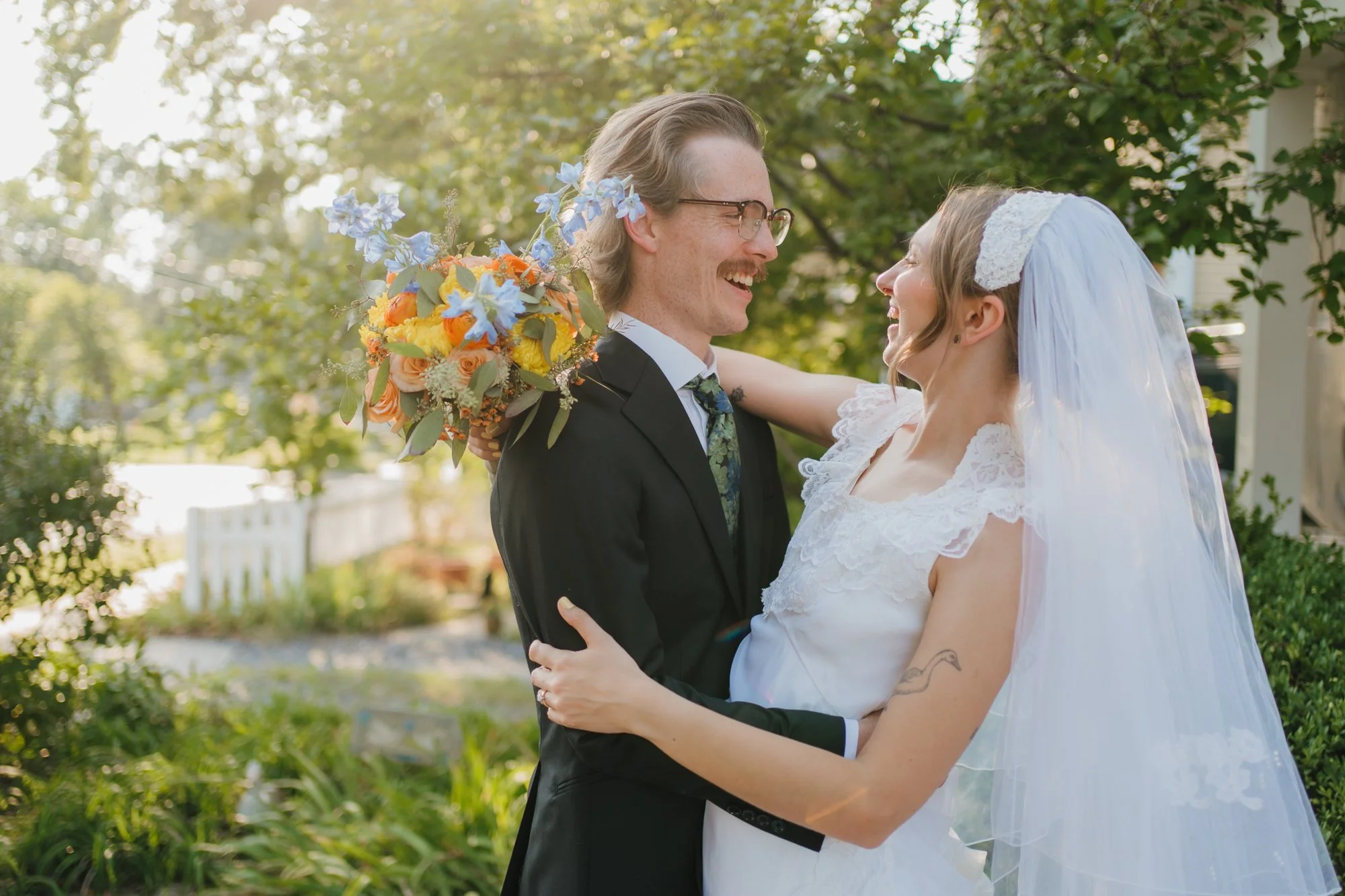 Zoe and Hunter laugh during their couple portraits.