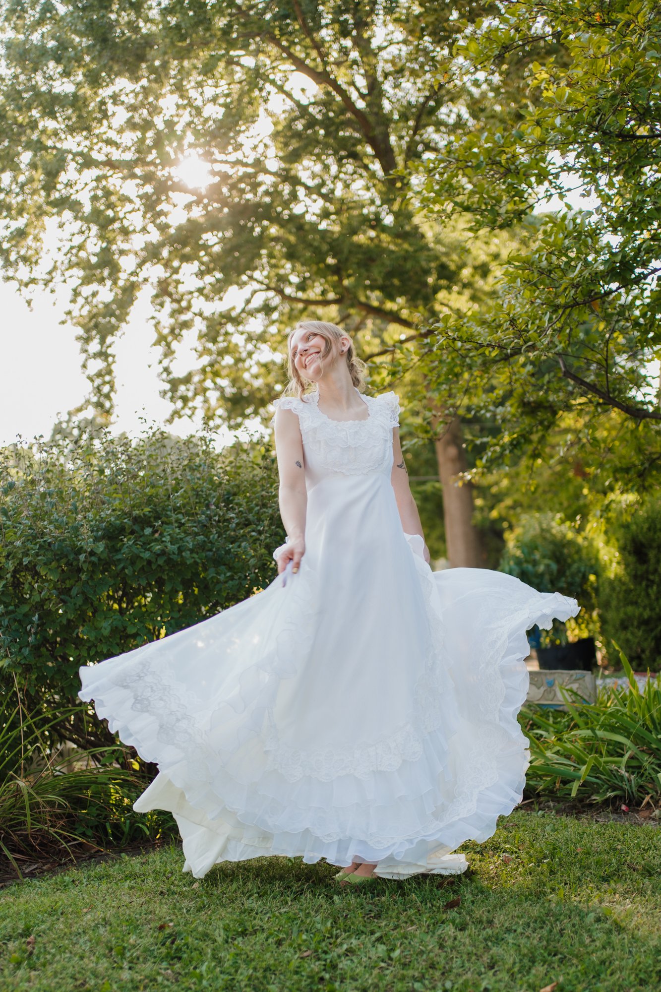 Zoe spins in her second hand wedding dress in the evening sun.