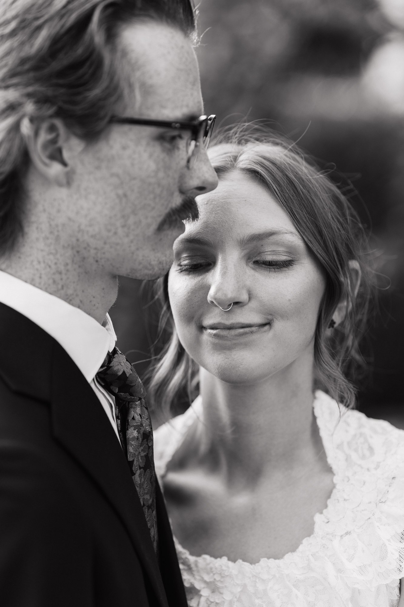 Close black and white portrait of Zoe and Hunter.