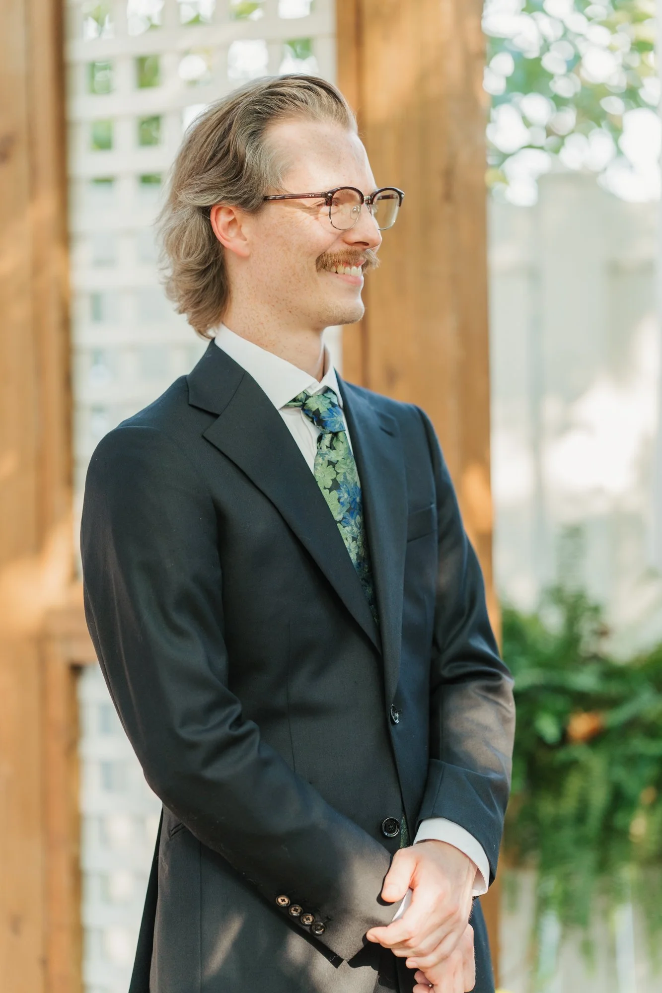 Hunter smiles as he sees Zoe at their backyard ceremony.
