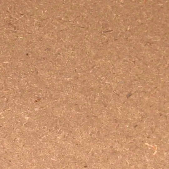 Close-up of sawdust-like proprietary partially carbonized organics filter material.