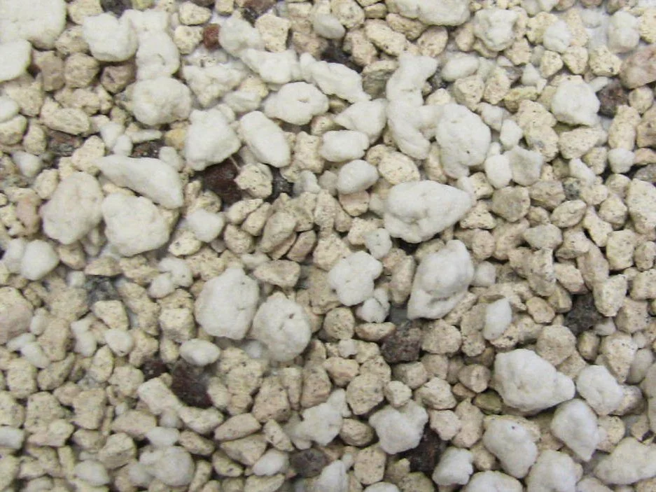 Close-up of white and black gravel looking phosphorus absorbing filter media for waste water.