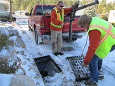 Clean Water Decontaminator being installed back into catch basin.