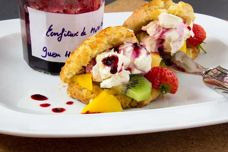 Cassava scones with mango, kiwi fruit, strawberries, jam and cream