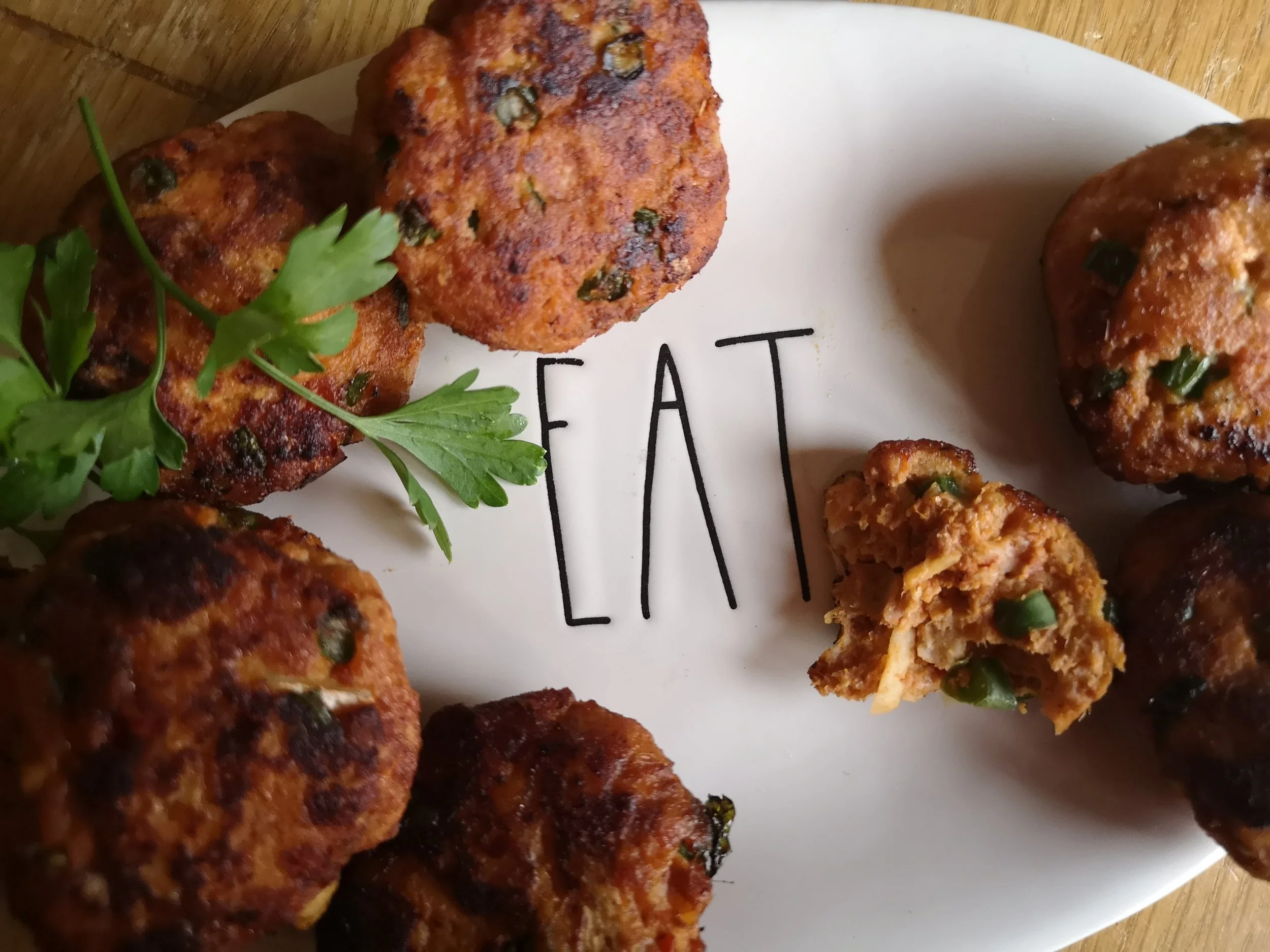Thai fishcakes served on an appropriately-labelled plate