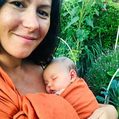 A mother with a tiny baby