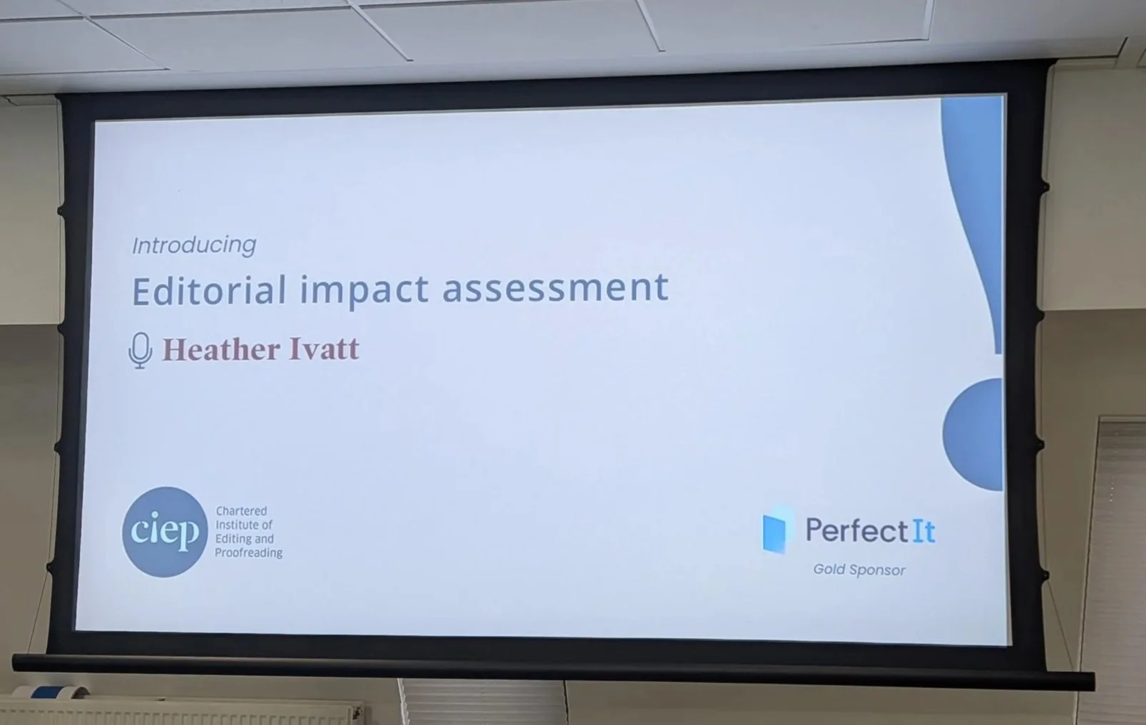 A photo of presentation screen, with the title slide of a CIEP session visible. It says 'Introducing Editorial Impact Assessment. Heather Ivatt'.
