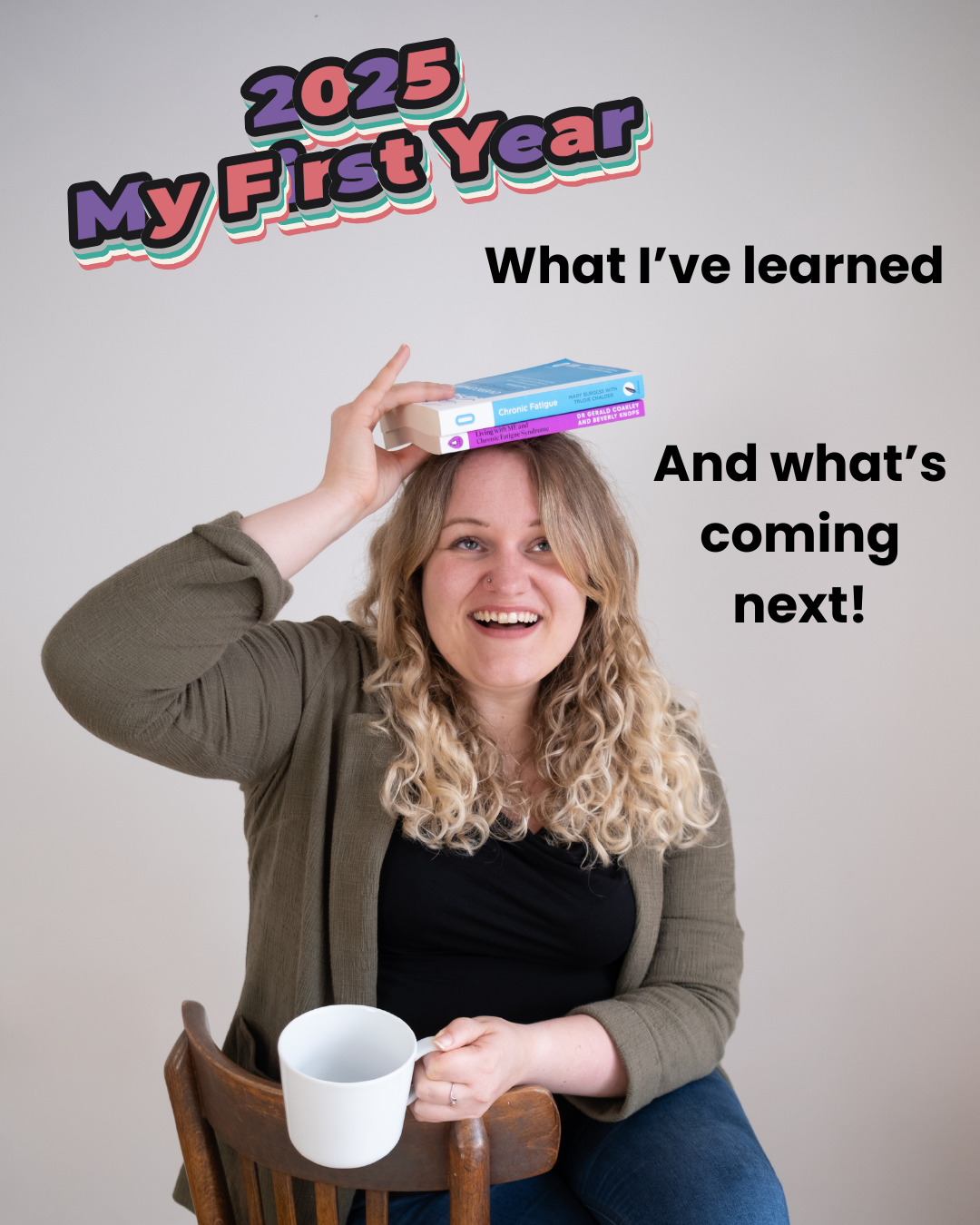 A blonde woman sits on a wooden chair, holding a coffee cup and balancing two books on her head with one hand. She is wearing jeans, a black top and a green blazer. The text says '2025 My First Year', 'What I've learned and what's coming next!'