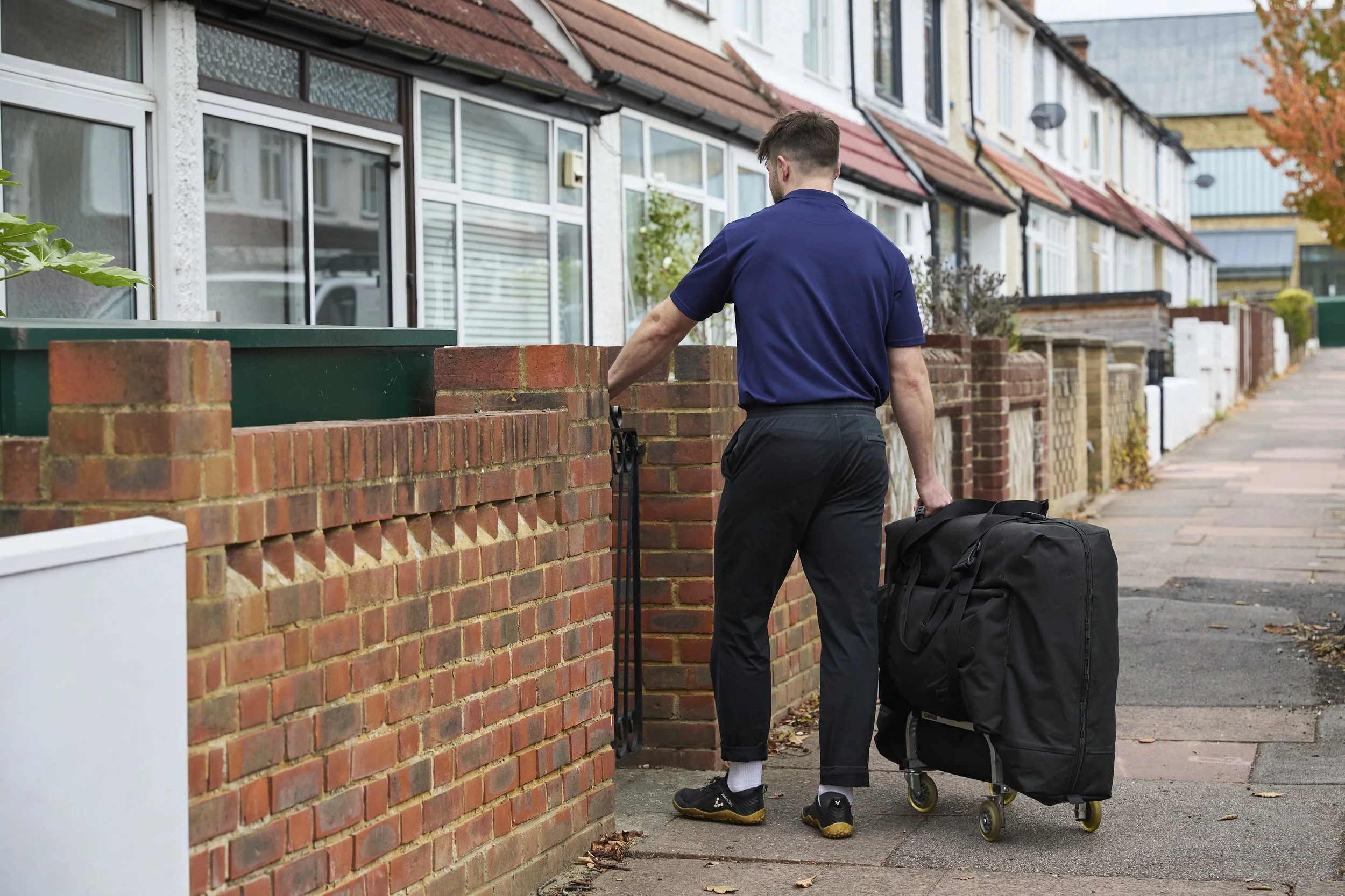 Home visit osteopath arriving at a patient’s home in Beckenham with a portable treatment table.