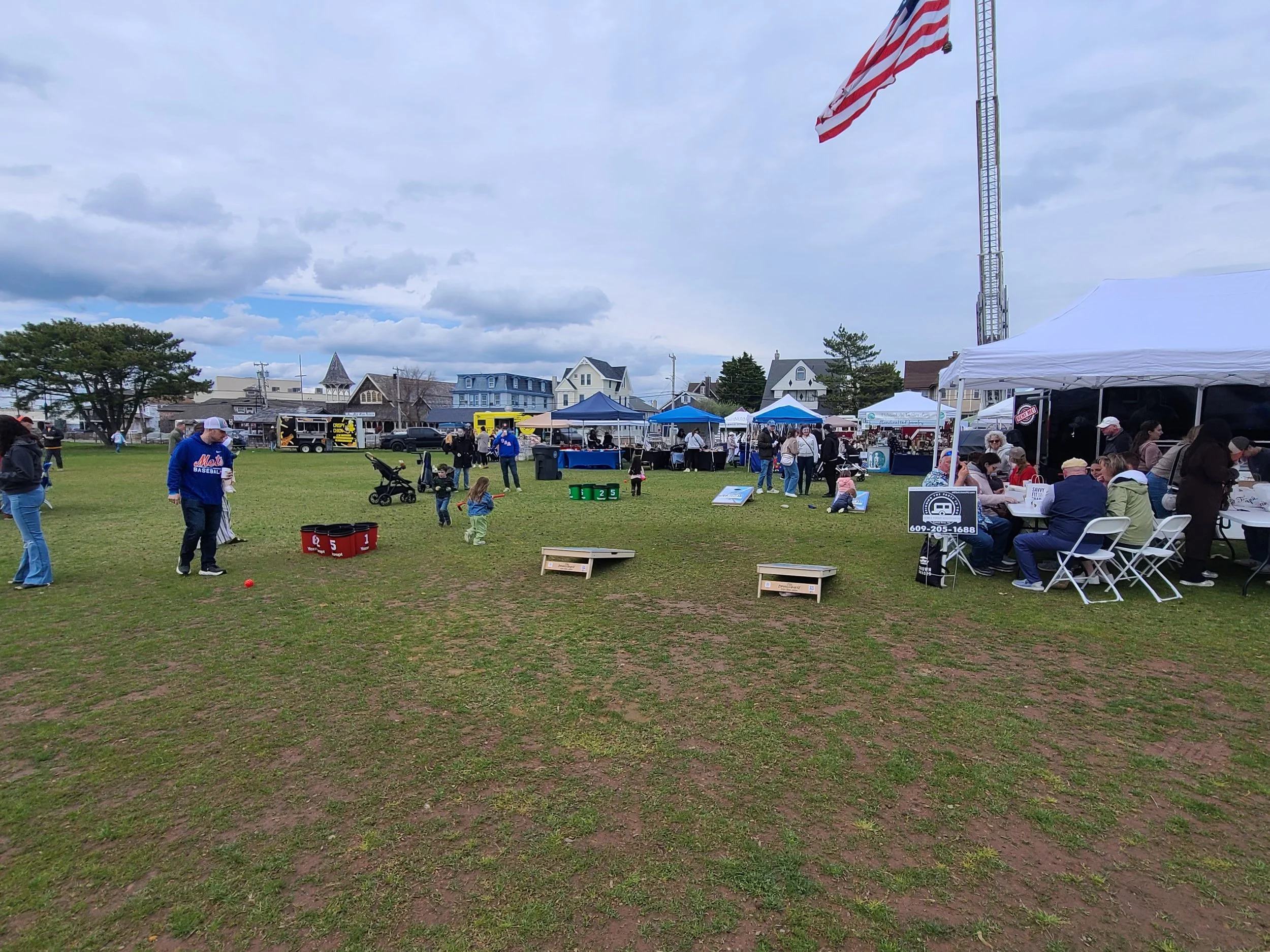 Mobile Golf Simulator Set-up for a Festival Event with Cornhole and Bucket Golf