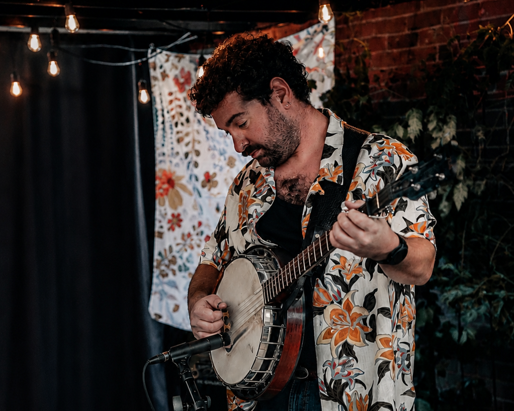 Alex Koukov playing bluegrass banjo.