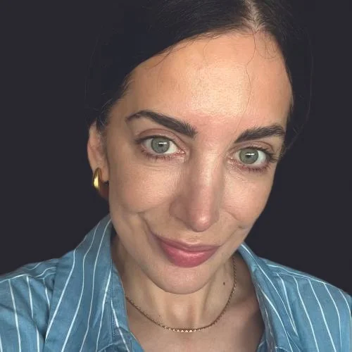 woman with dark hair and blue shirt