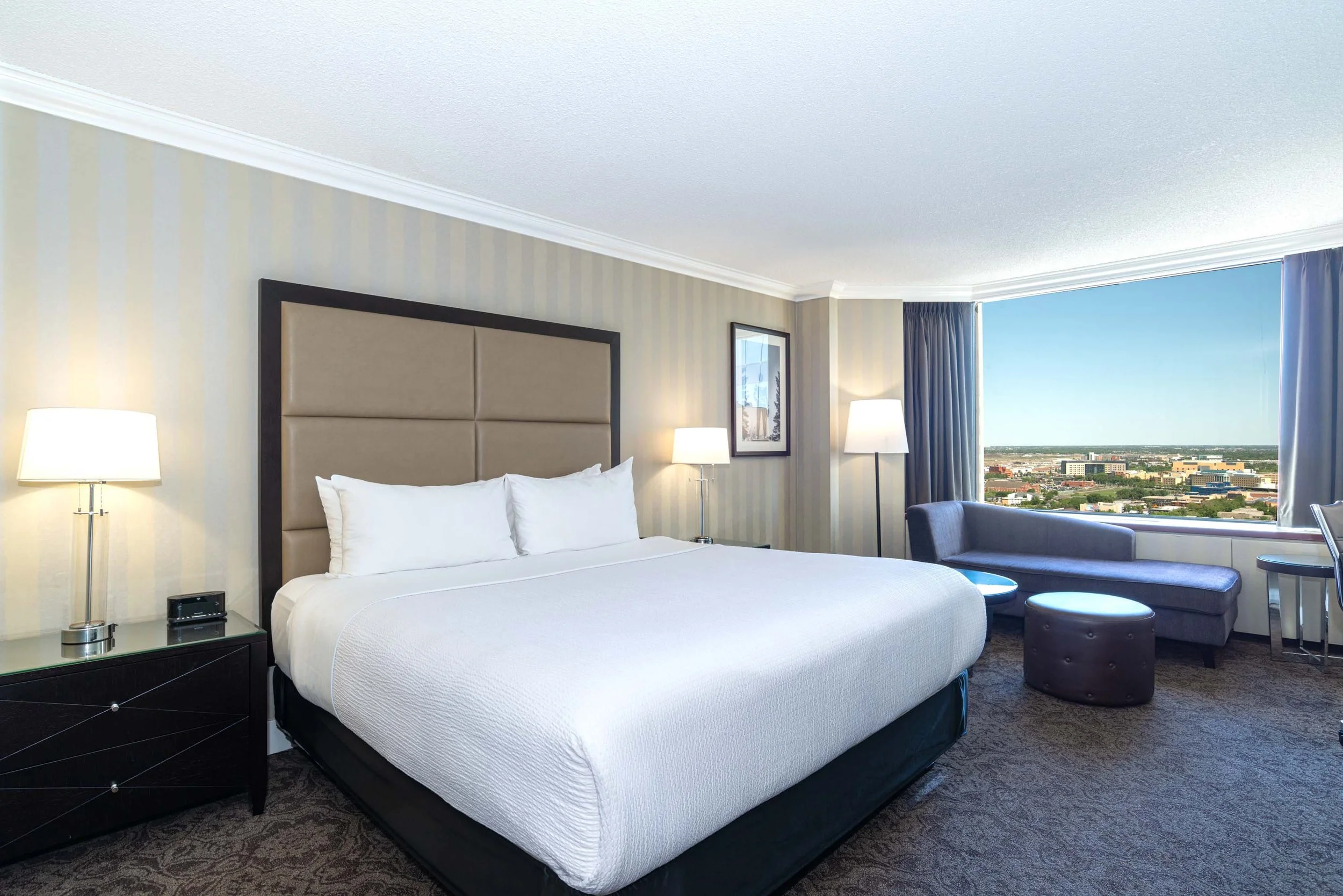 large bed in a bright hotel room