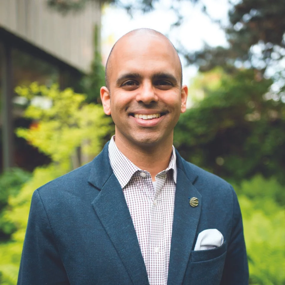 man in blue suit jacket