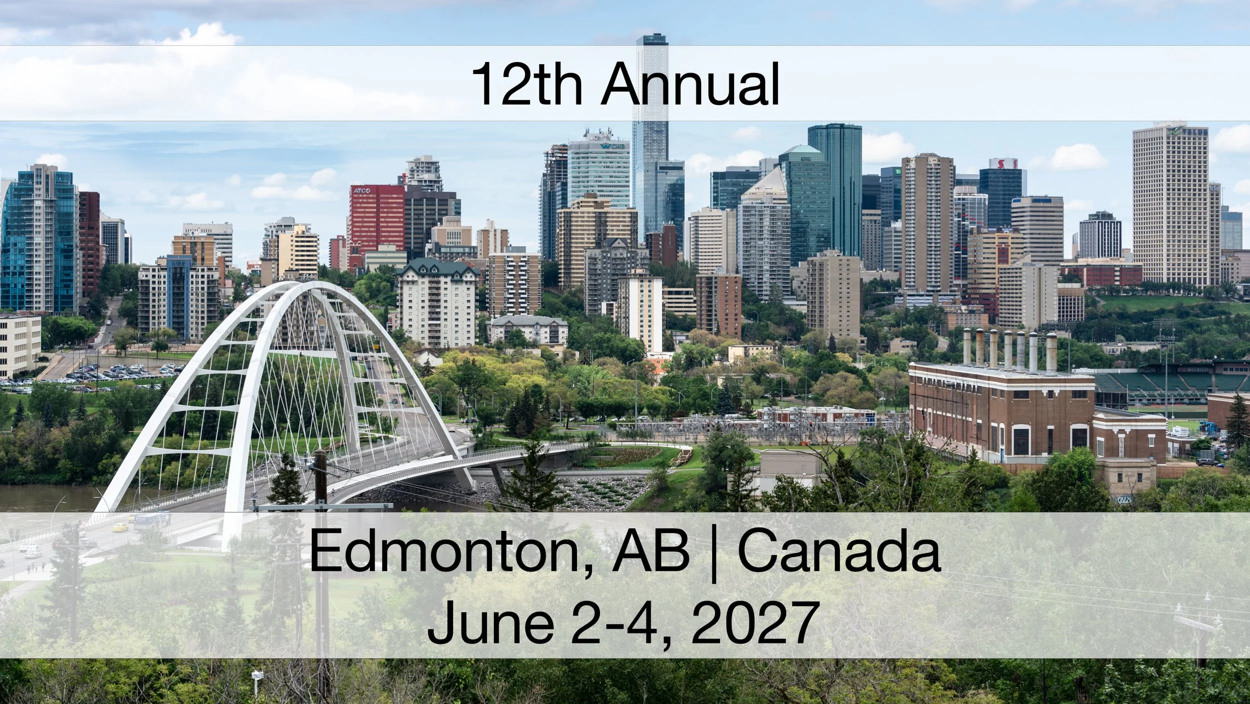 Skyline of Edmonton, Alberta, Canada with modern high-rise buildings, a white arch bridge over a river, and green trees in the foreground, under a partly cloudy sky. The location of the 12th annual Canada's Fundraising Conference, June 2-4, 2027.
