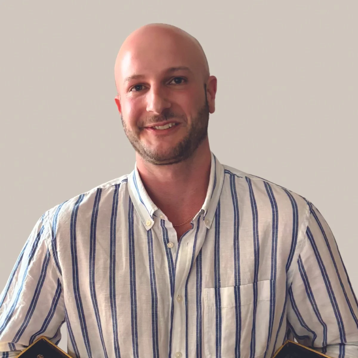 man with white and blue striped shirt