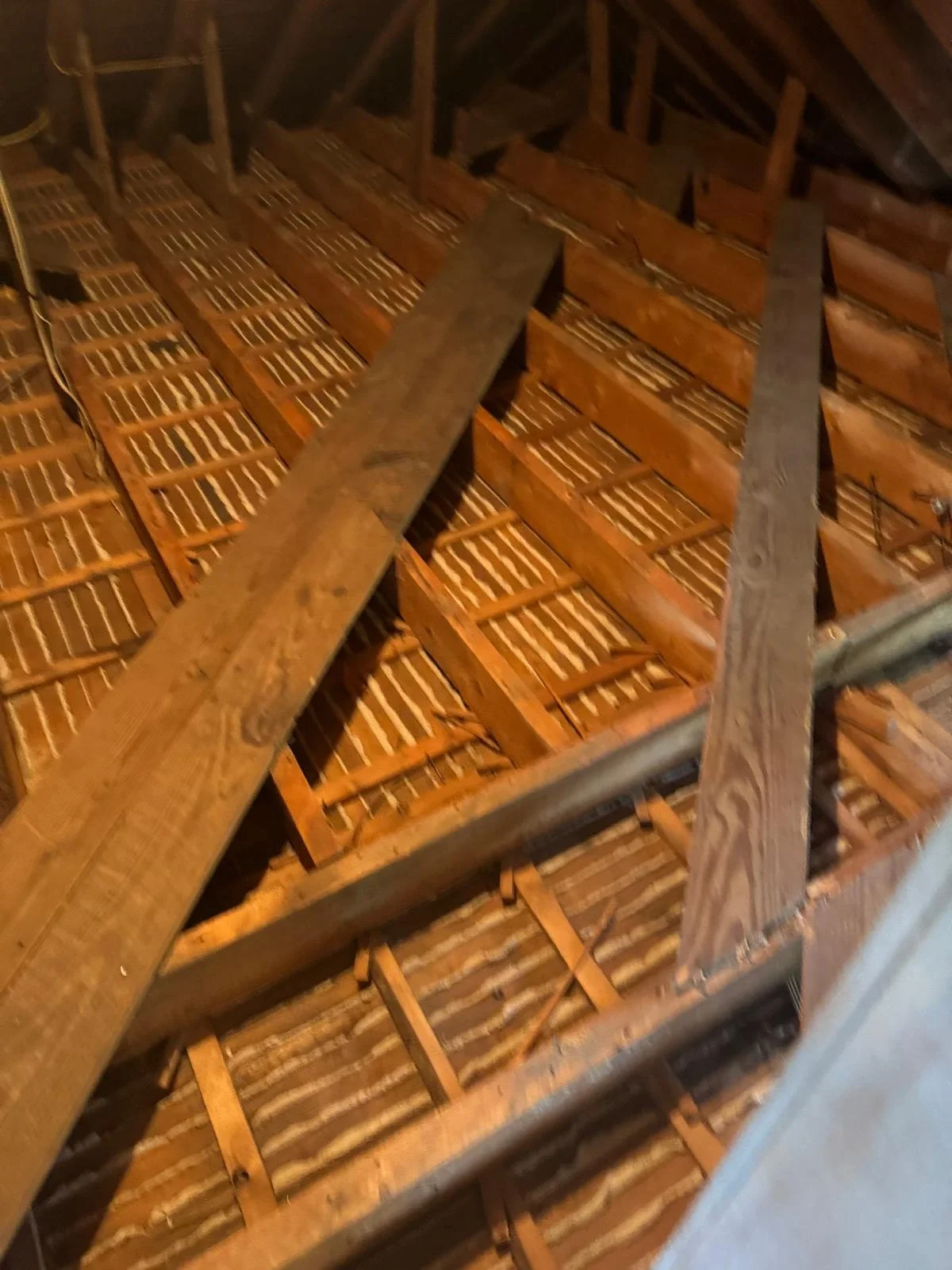After: Old insulation completely removed, leaving the attic clean and ready for the next phase.