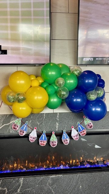 Colorful balloon garland with money balloons and birthday banner