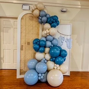 Rattan backdrop. handmade and natural wood colored. With balloons around it