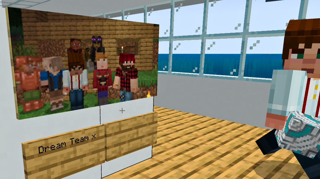  A group of Minecraft characters in a pixelated forest setting, with the text "Dream Team x" on a wooden sign below them. A person in a white shirt with red and yellow stripes is visible on the right.   