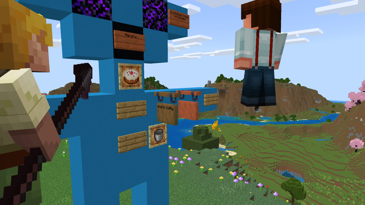  A Minecraft character with a pickaxe stands in front of a large blue structure of a figure with various signs and items, while another character floats in the background over a scenic landscape.   