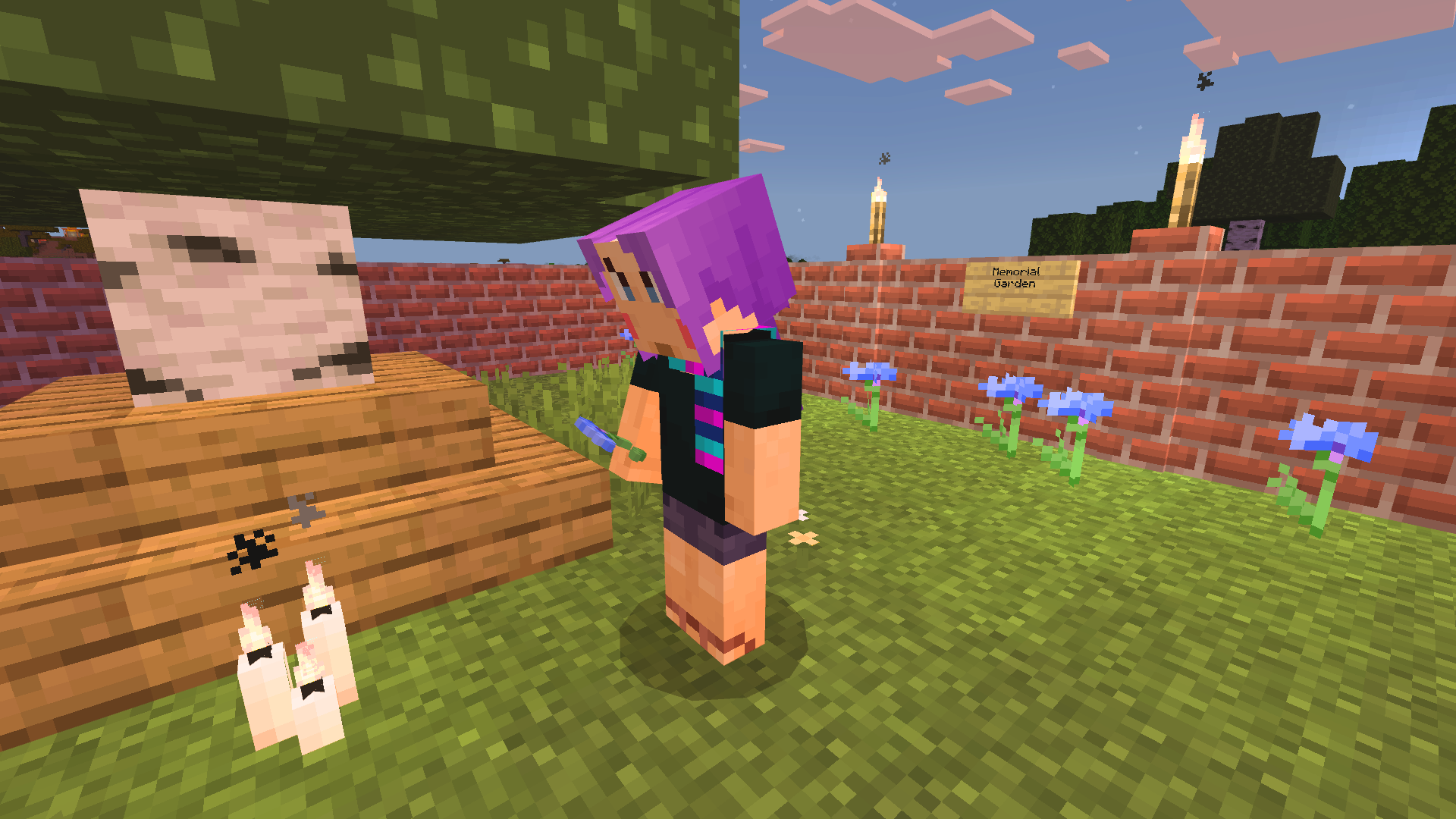 A Minecraft character in a memorial garden looking at candles