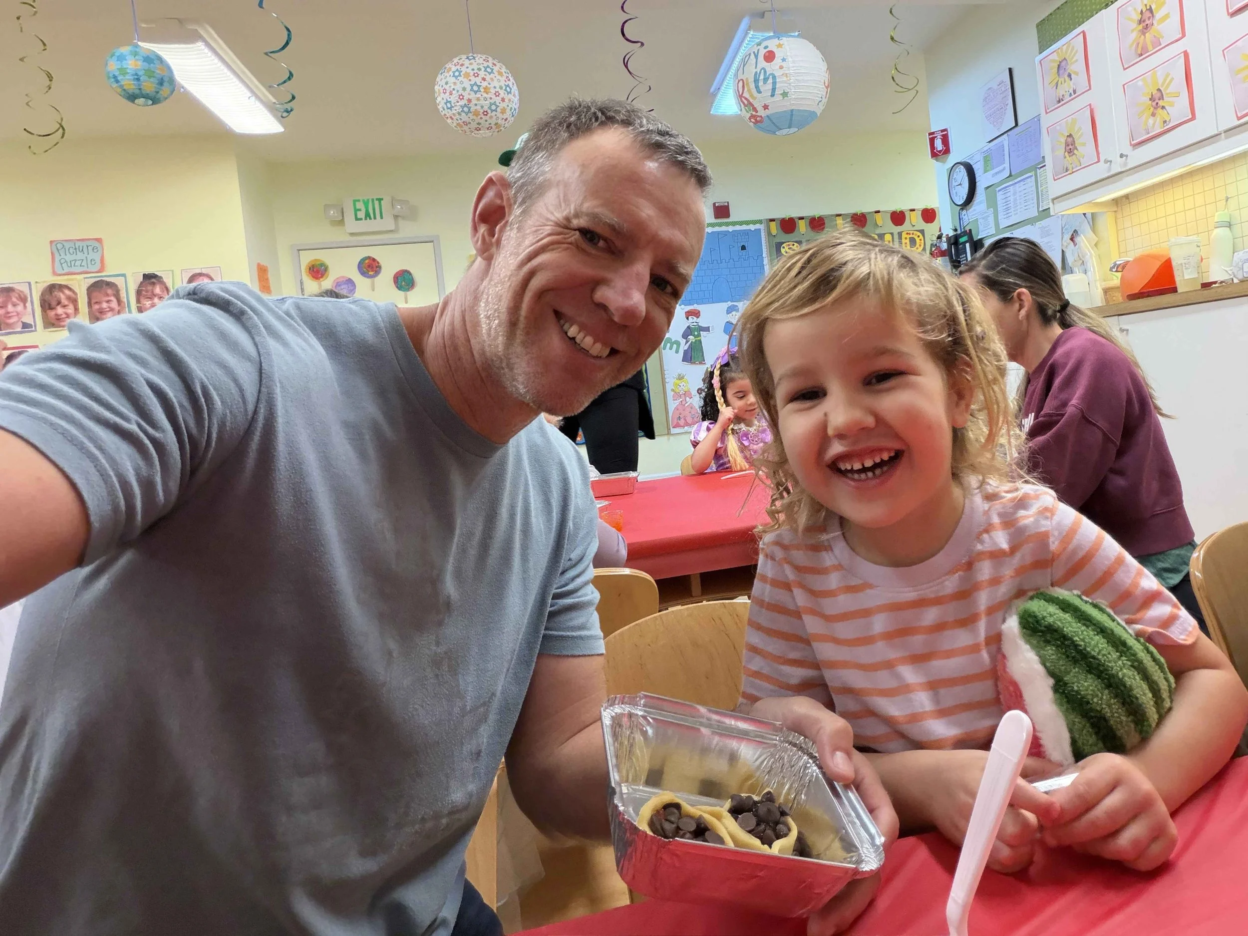 Dad and daughter in class making Hamantaschen