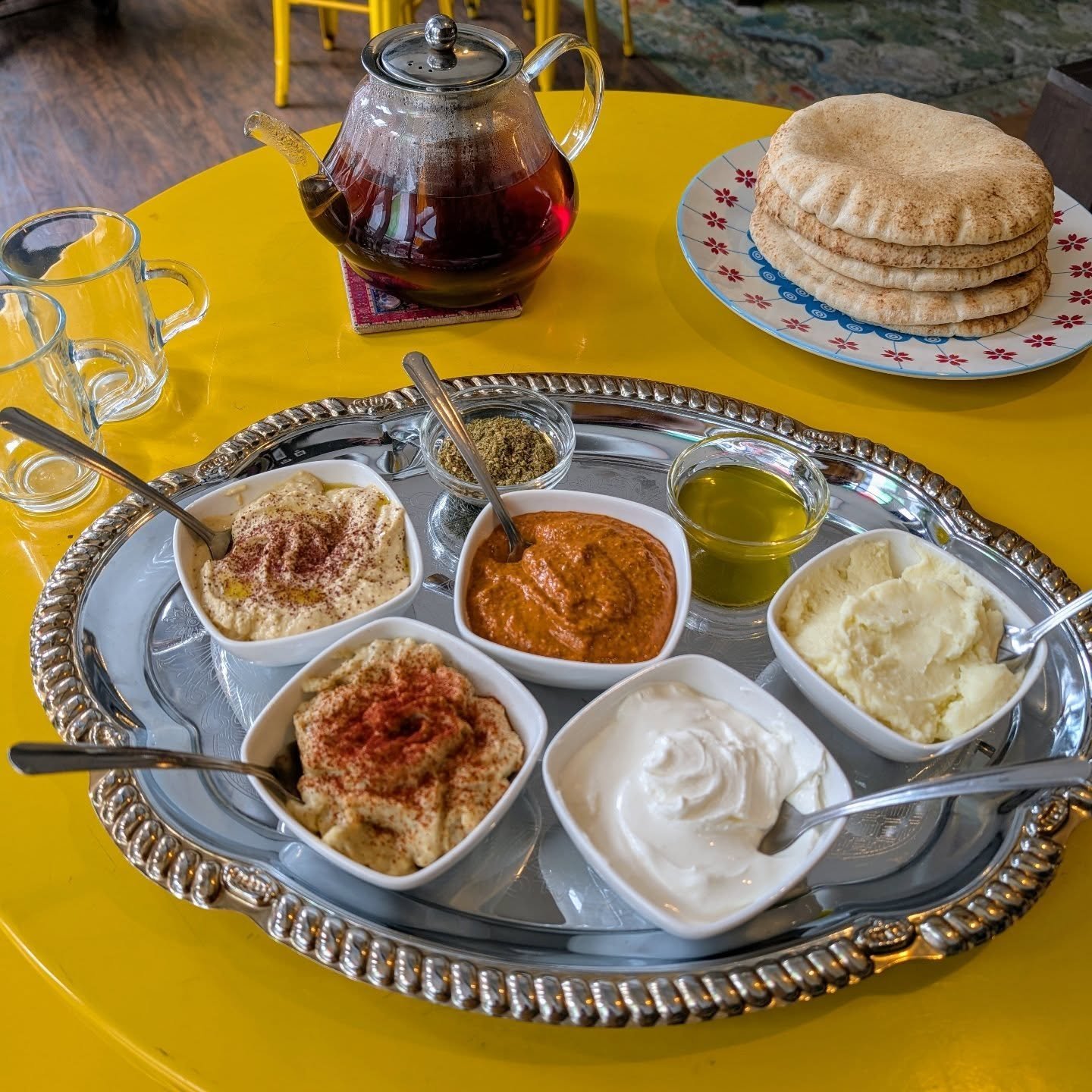 Introducing our NEW food menu!
Try a platter of one of our delicious house made dips, served with pita, olive oil, and zataar. Have some hummus, baba ghanoush, muhammara, muthawama, or labneh. Or bring some friends and have all of the above!
Perfe