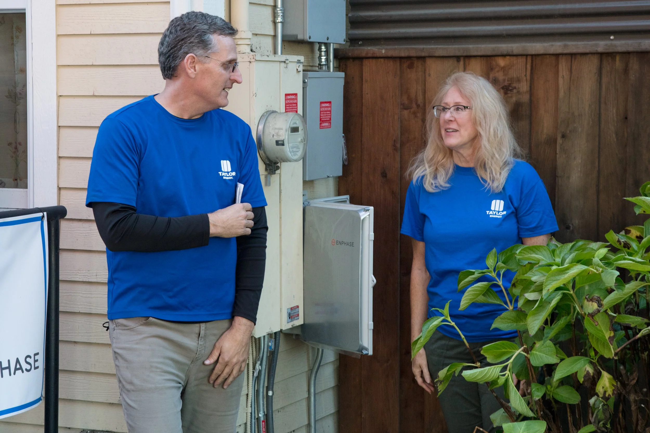 Two people about to turn solar on