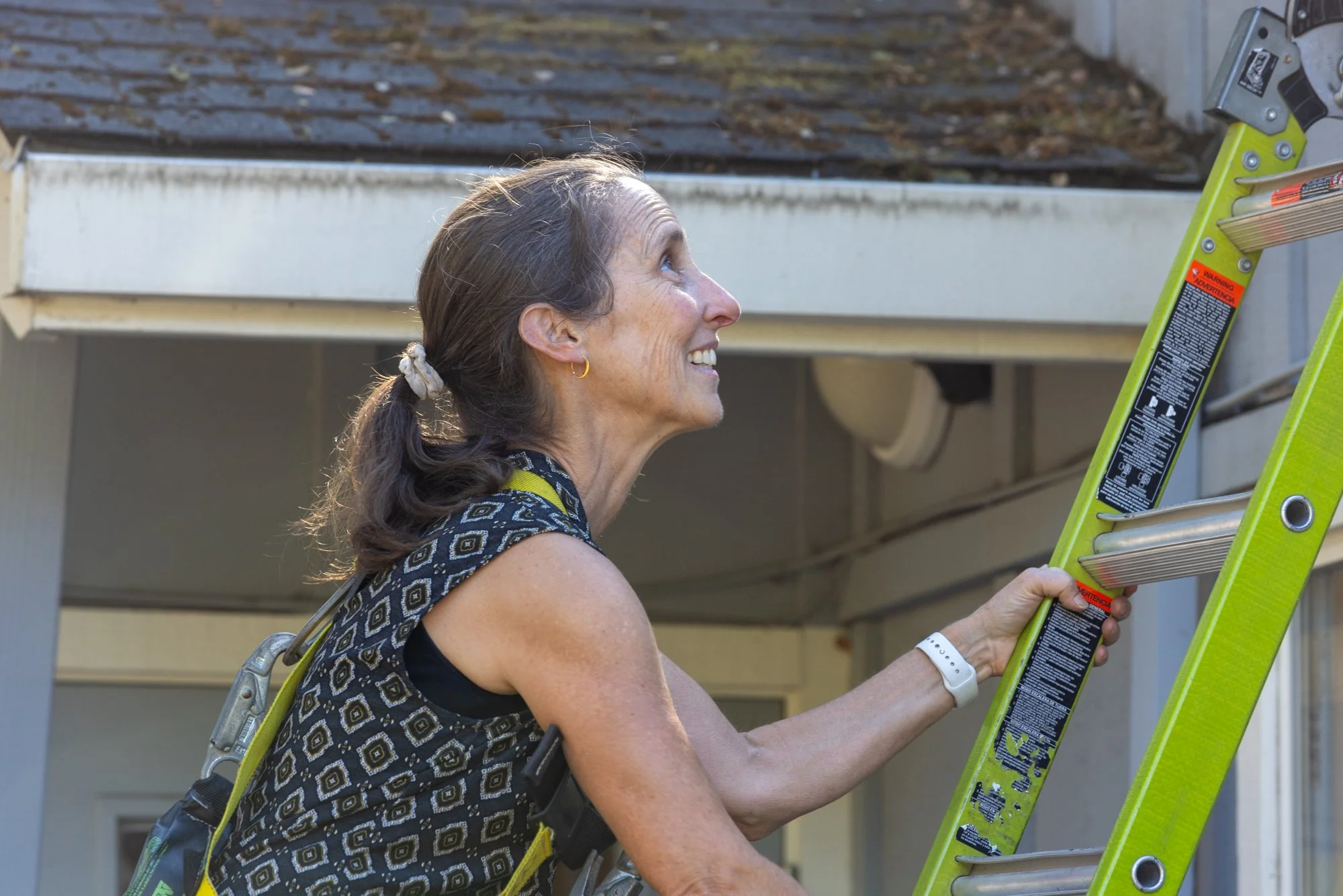 woman climbing up a ladder