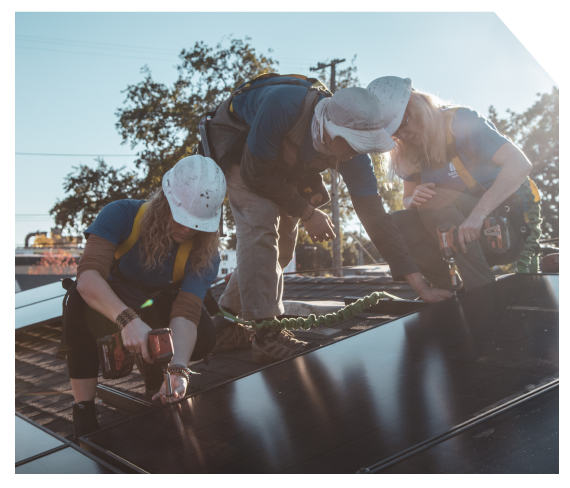 Volunteers working on solar panels