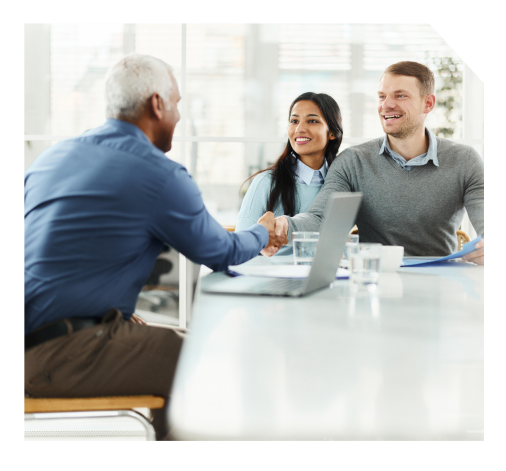 A couple shaking hands with a sales representative