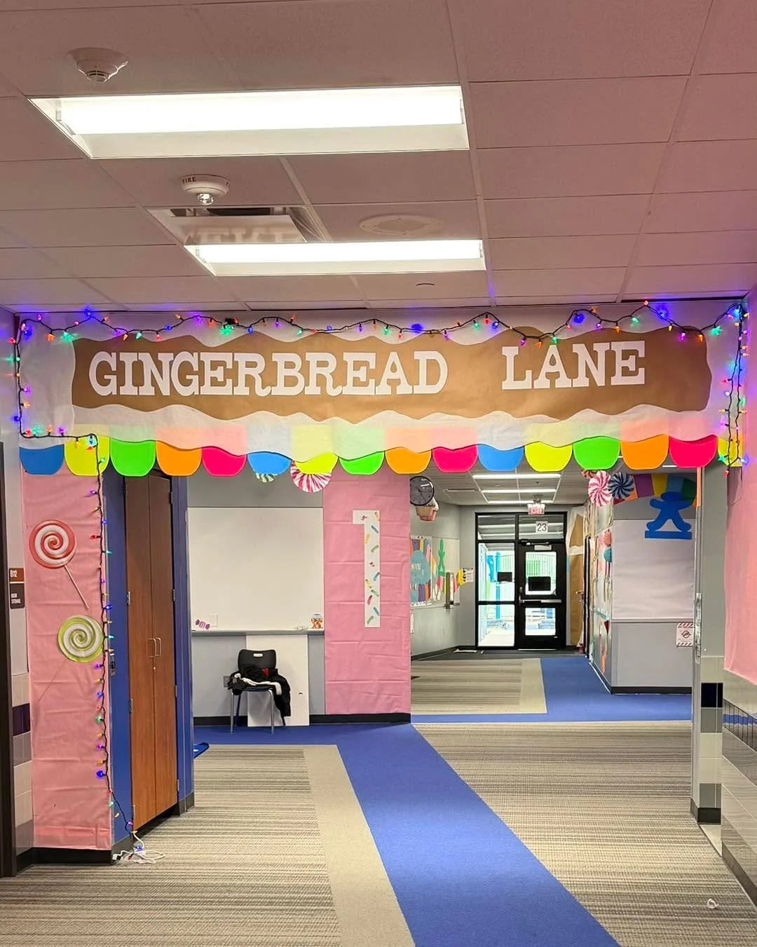 POV: December hits and suddenly the First Grade Hallway looks like Santa hired a Pinterest mom army. 😂 We thought we were just adding some lights and paper and the next thing we knew, we built an entire gingerbread suburb. We understood the assignme