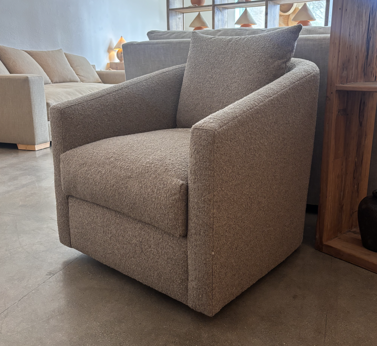 This soft upholstered swivel chair blends relaxed coastal elegance with everyday comfort. Custom made with premium fabric and tailored cushioning, it offers effortless movement and refined design. Perfect for coastal homes seeking bespoke furniture w