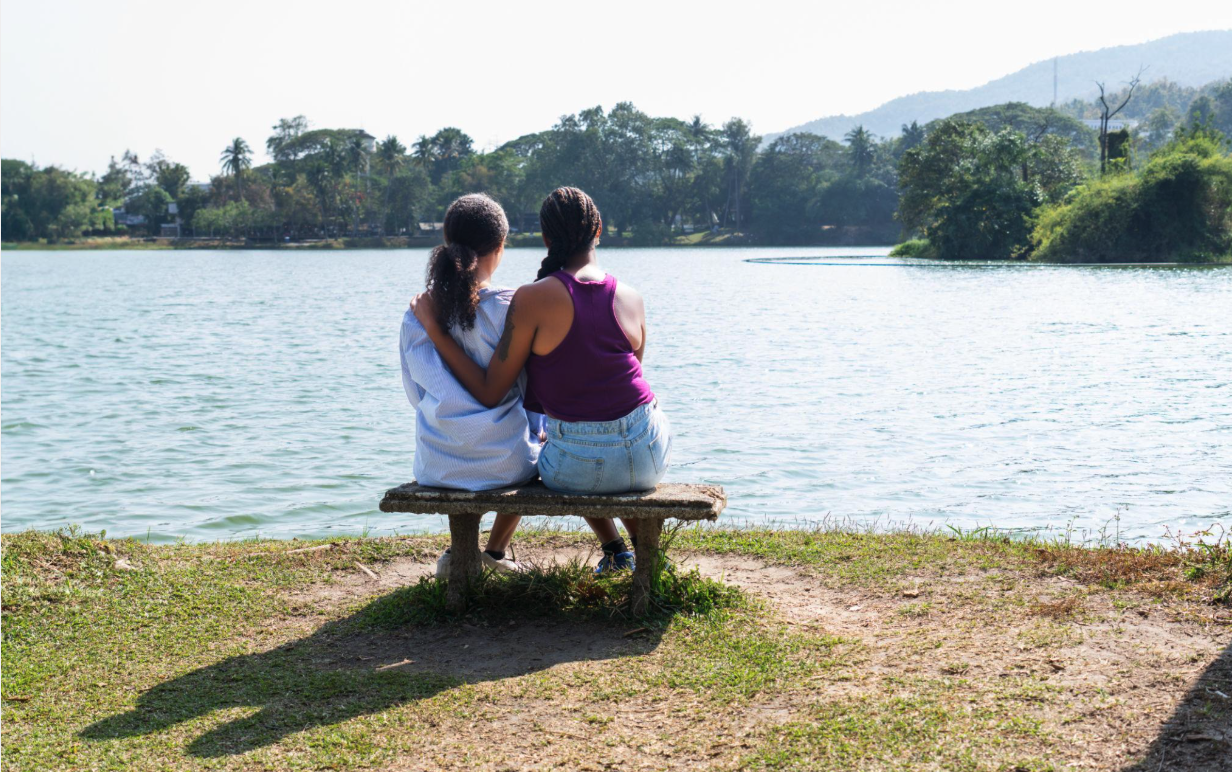 wo people offering one another comfort and support, representing connection and compassion in caregiving.