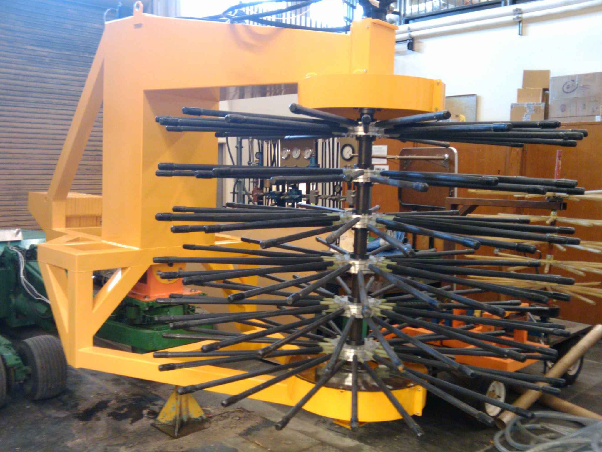 The main vertical shaft visible here oscillates laterally due to it being mounted eccentrically from the motor shaft.