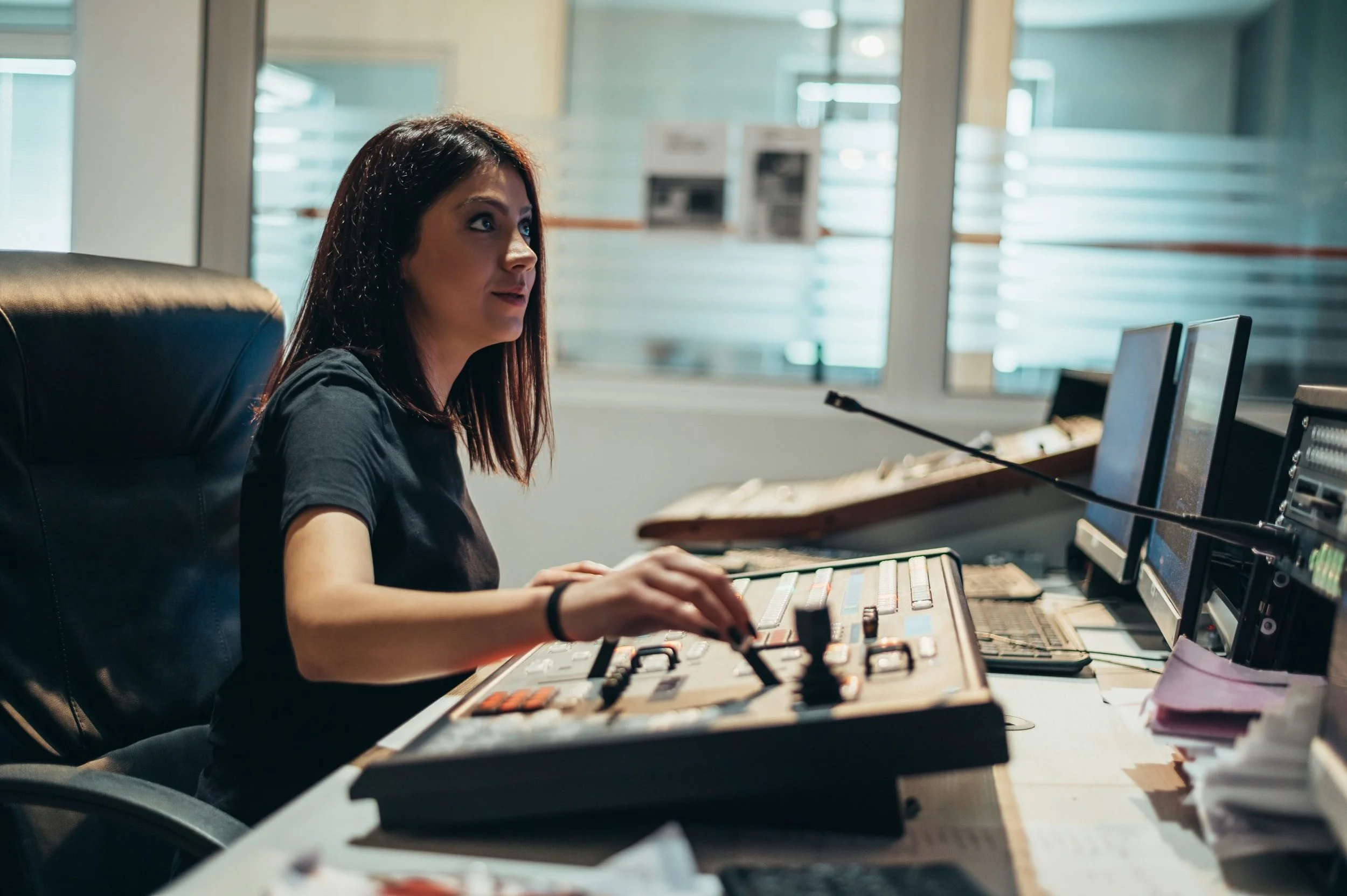 young-beautiful-woman-working-in-a-broadcast-contr-2023-11-27-05-04-30-utc-scaled.jpg