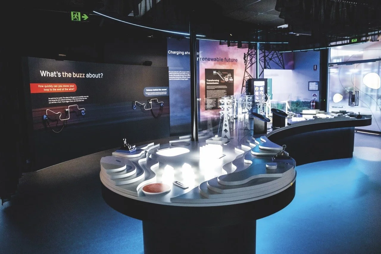 Interactive technology exhibit in the CopperString 2032 Experience Centre with displays about renewable energy and sustainable future.