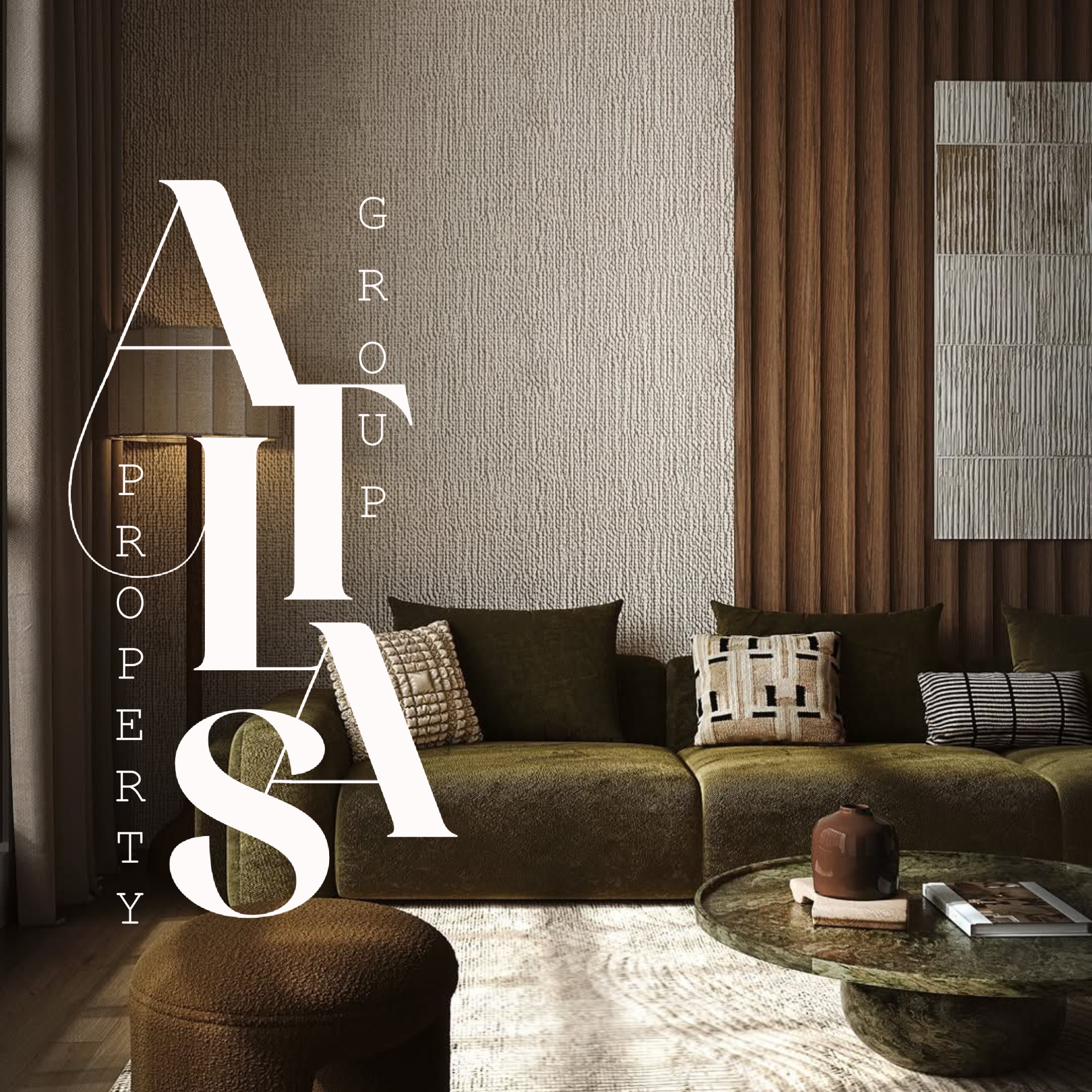 Living room with a textured beige wall, green sofa with decorative pillows, wooden wall panel, round coffee table with a brown vase and magazine, and a small round ottoman.