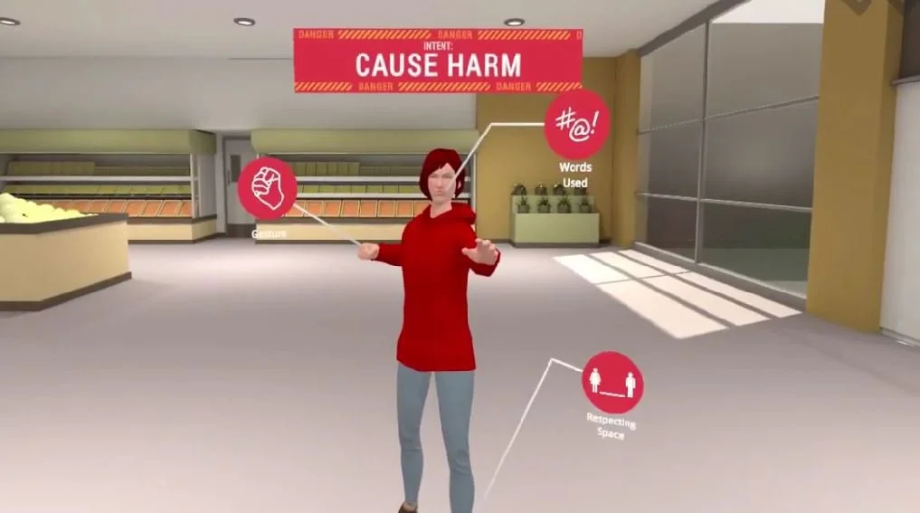 A virtual character in a grocery store highlighting behaviors that cause harm, including words used, respecting space, and harmful gestures, with a warning sign about cause harm.